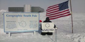 QAnon Supporter with WWG1WGA Sign at South Pole, Antarctica